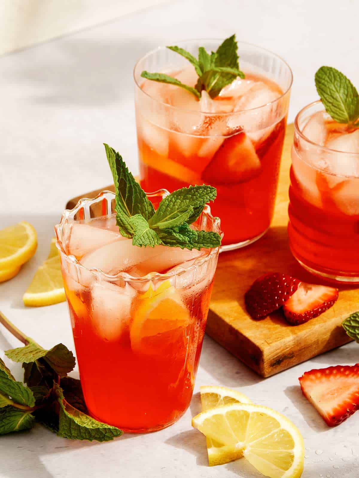 Strawberry lemonade in glasses with garnish. 