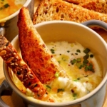 Baked eggs with toast dipped in.