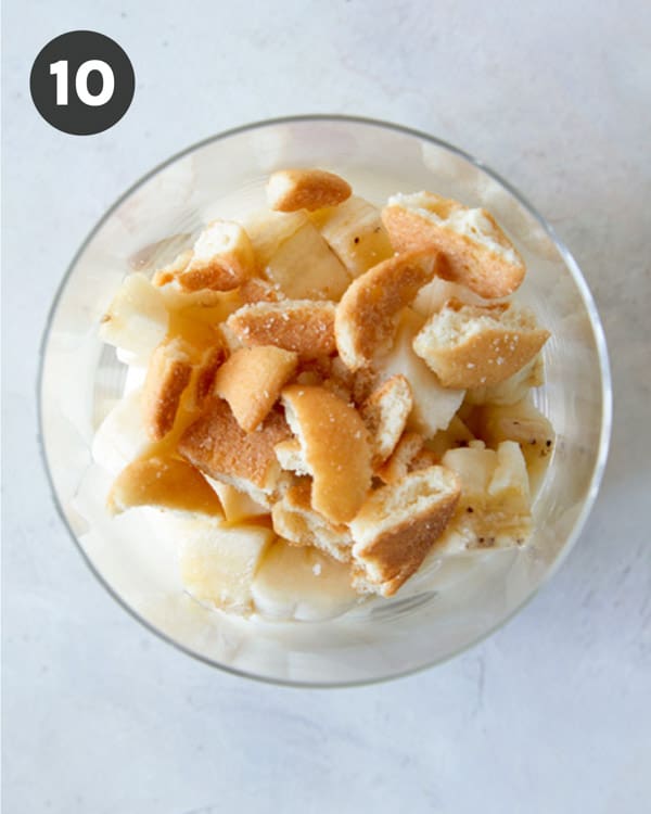 Nilla wafers and banana pudding layered in a bowl.