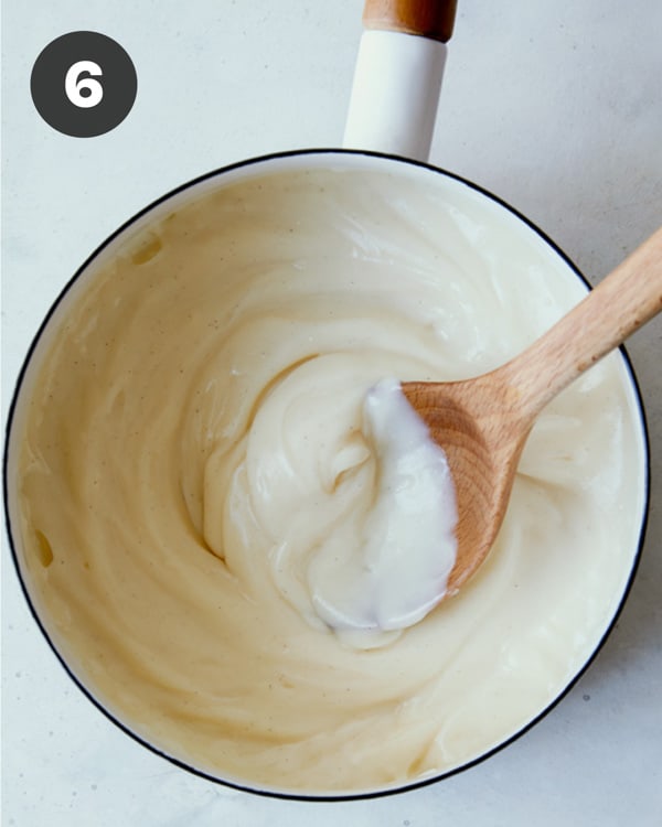 Banana pudding a pot being made.