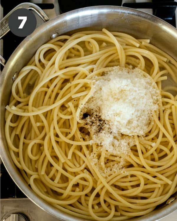 Bucatini in a skillet with parmesan. 