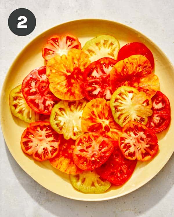 Heirloom tomato slices on a platter. 
