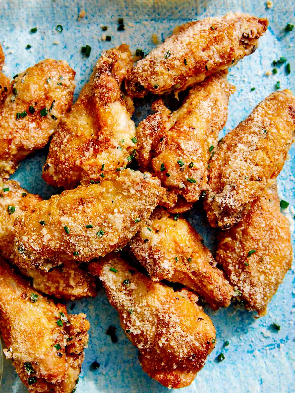 Parmesan chicken wings made in the air fryer on a platter.