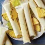Pina colada ice pops on a platter.