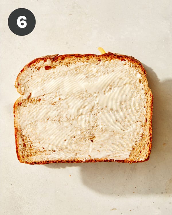 A tuna melt ready to be made in a skillet.