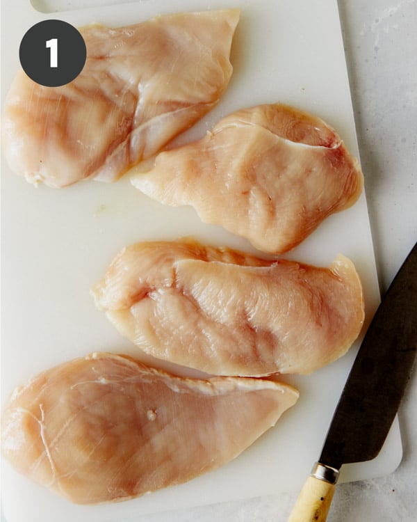 Chicken breasts sliced in half for tuscan chicken recipe.