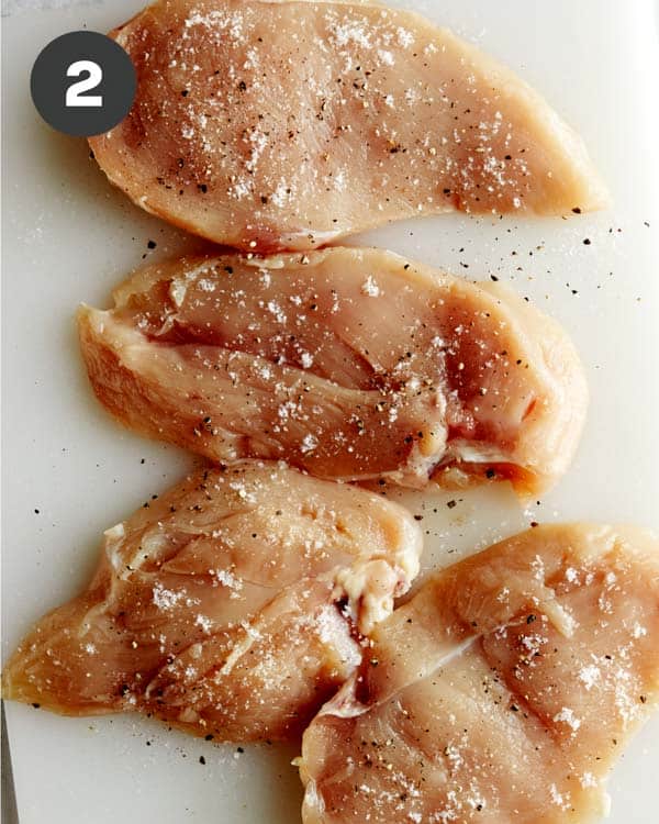 Seasoned chicken breasts to make tuscan chicken.