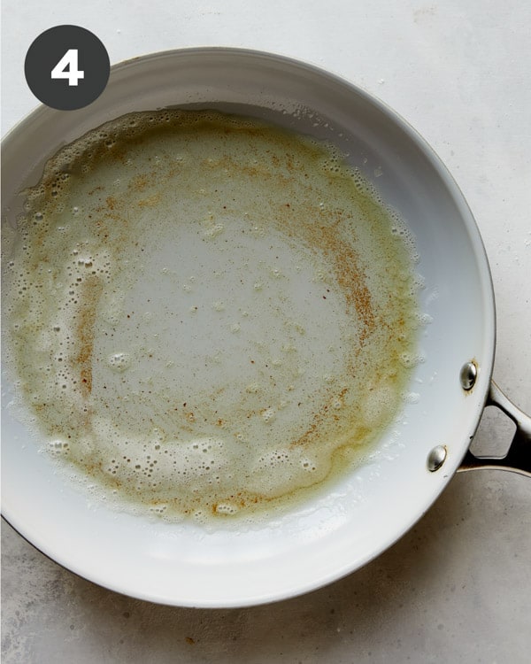 Melted butter in a skillet.