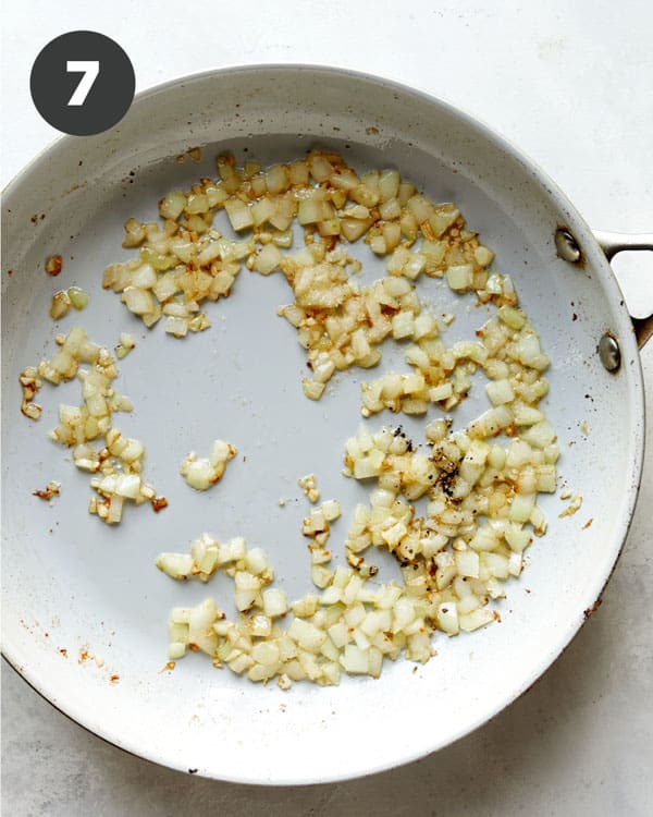 Onions cooking in a skillet.