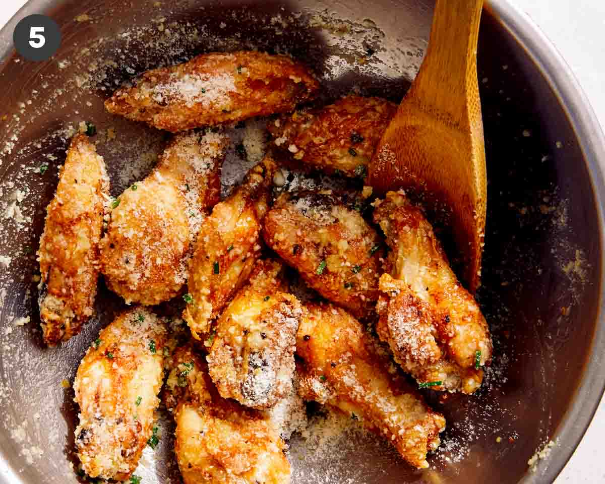 Parmesan dusted chicken wings in a bowl. 