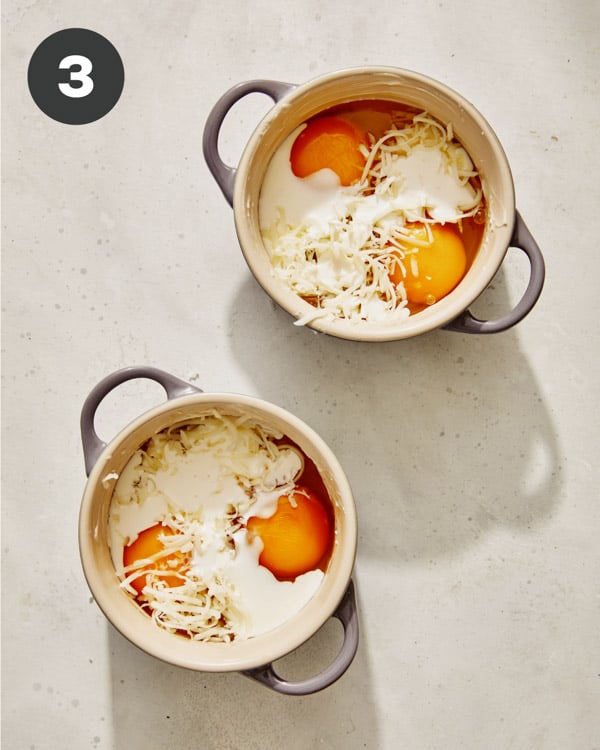 Eggs in cocotte with cheese and cream poured in. 
