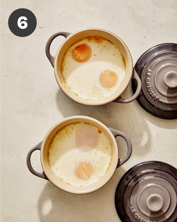 Baked eggs in cocotte fresh out of the oven.