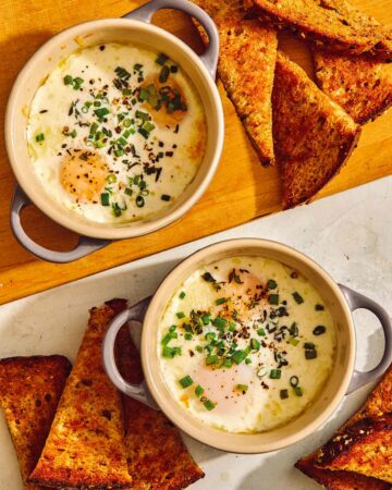Baked eggs in cocotte with toast on the side.