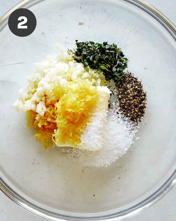 Butter and herbs in a glass bowl for Spatchcock chicken.