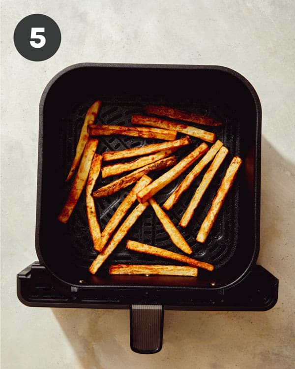 French fries in an air fryer cooked. 