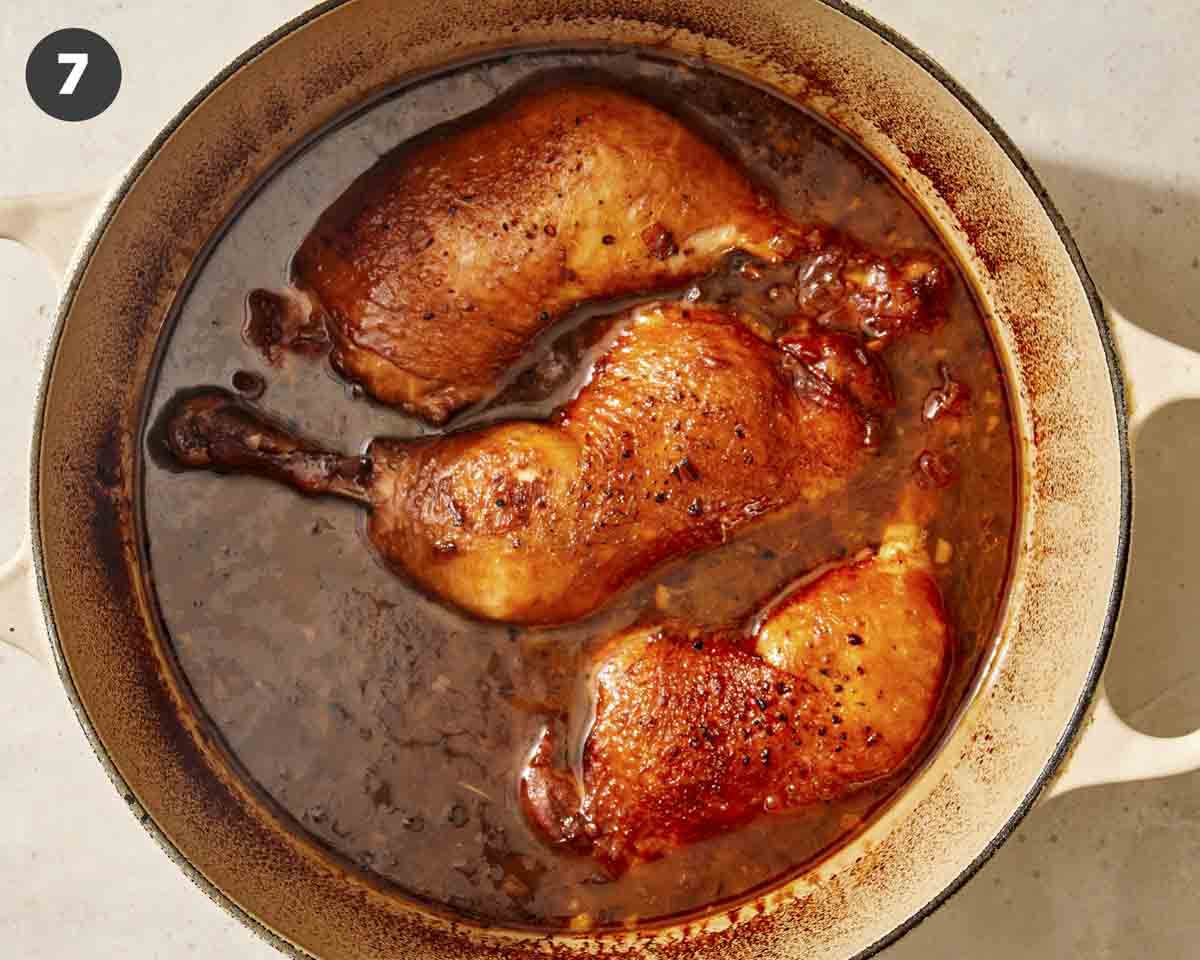 Chicken braised in a dutch oven.