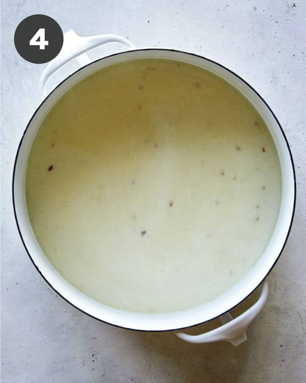 A stock pot full of the base for Loaded Baked Potato Soup.