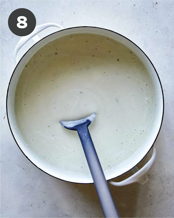 Loaded baked potato soup in a pot ready to be served.