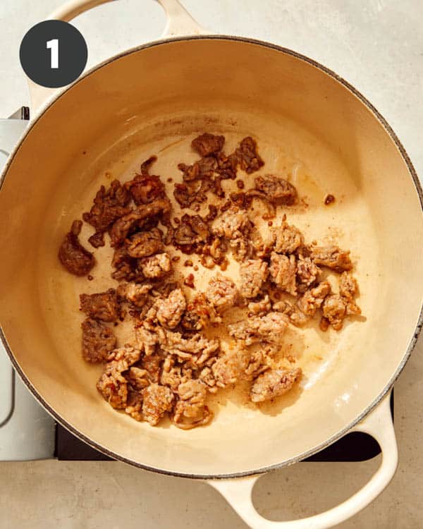 Sausage cooking in a pot.