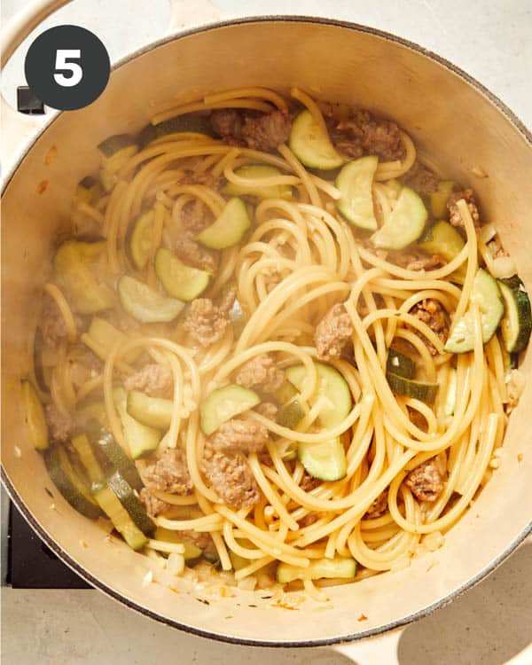 Pasta with zucchini and sausage.
