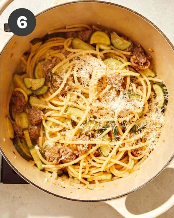 One pot pasta with parmesan on top.