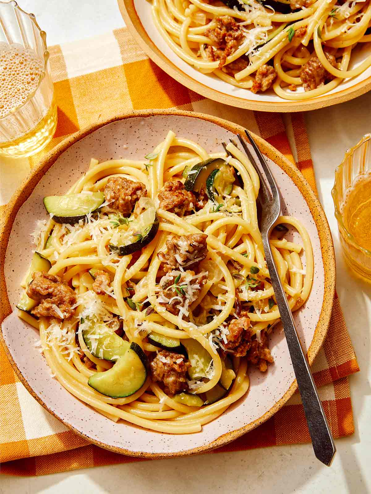 One pot pasta in a couple of bowls with a fork in it. 