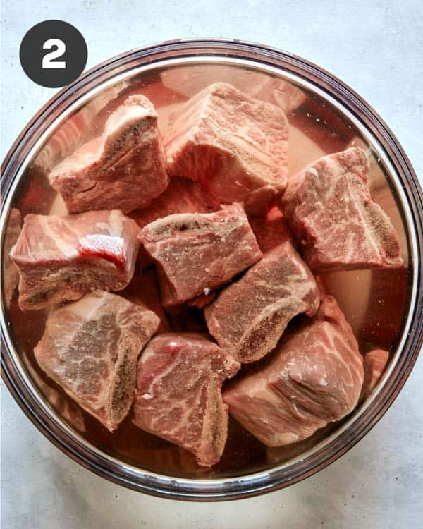 Short ribs for galbi jjim soaking in water.