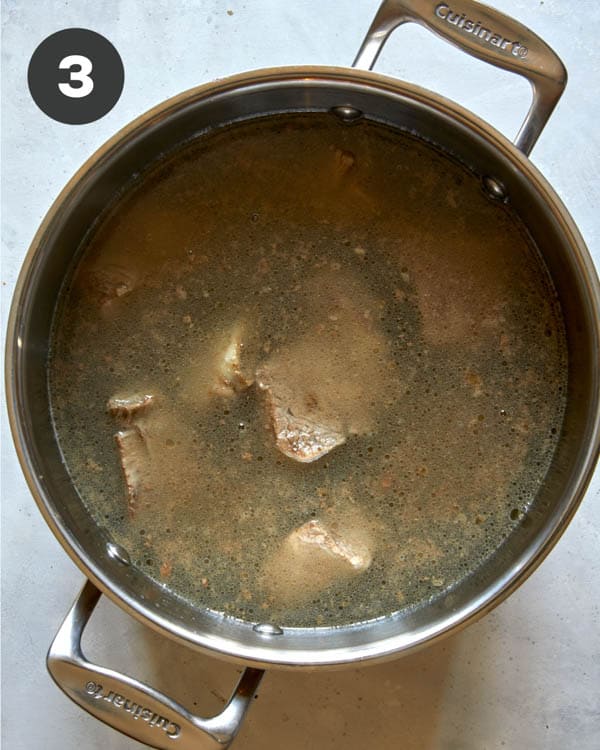 Short ribs boiled in a pot of water. 