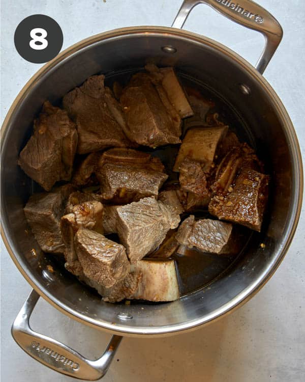 Short ribs in a pot mixed with braising liquid to make Galbi Jjim. 