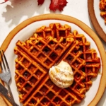 Pumpkin waffle recipe on a plate being served.