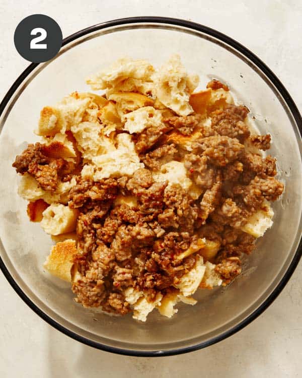 Sausage in a bowl with baguette to make a stuffing recipe. 