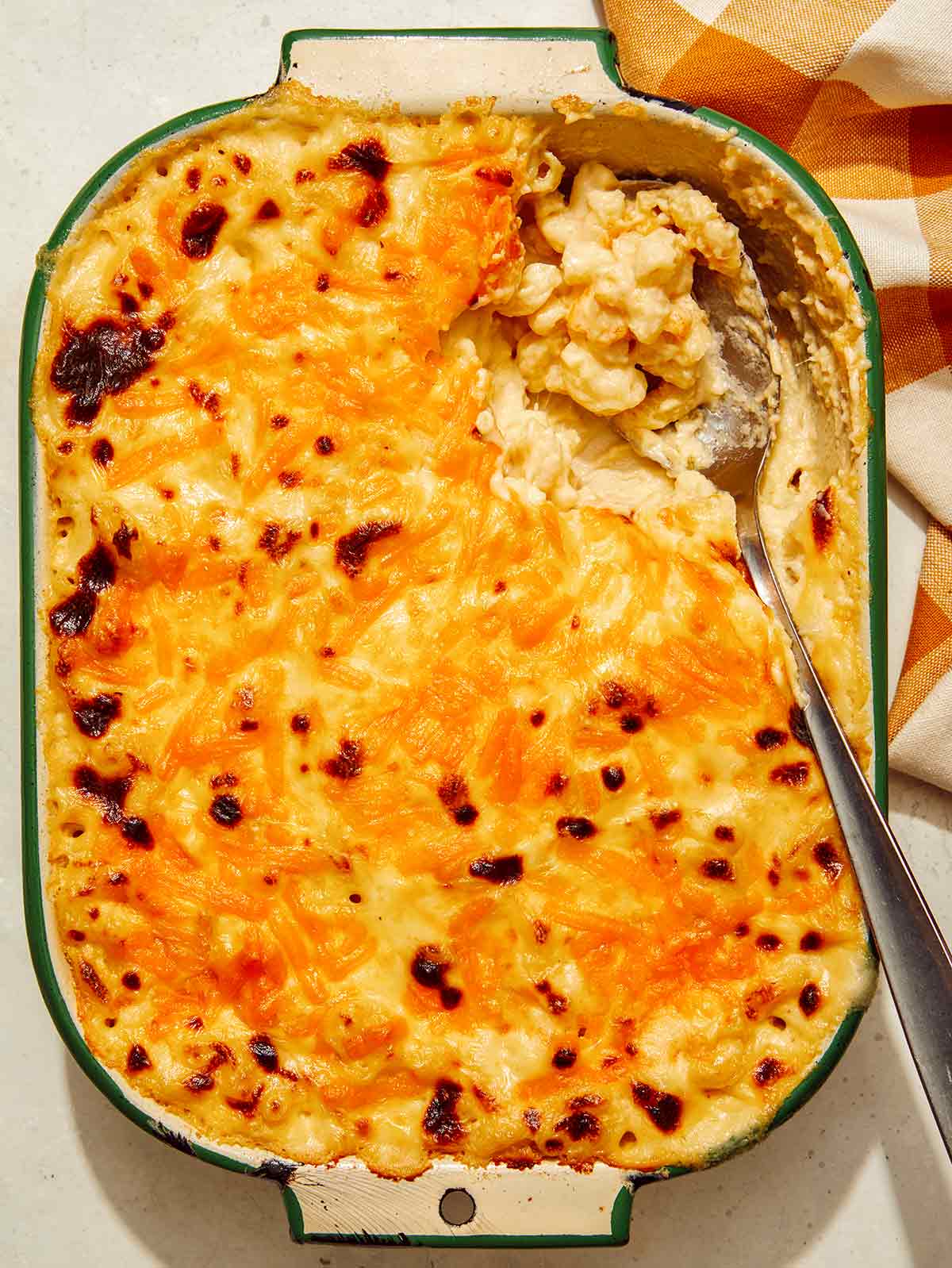 Baked mac and cheese close up in a casserole dish.