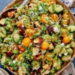 Shaved brussel sprout salad recipe in a bowl.