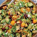 Shaved brussel sprout salad recipe in a bowl.