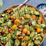 Shaved brussel sprout salad recipe in a bowl.