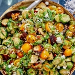 Shaved brussel sprout salad recipe in a bowl.