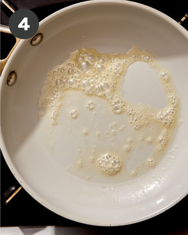 Butter melted in a skillet to cook buttermilk pancakes. 