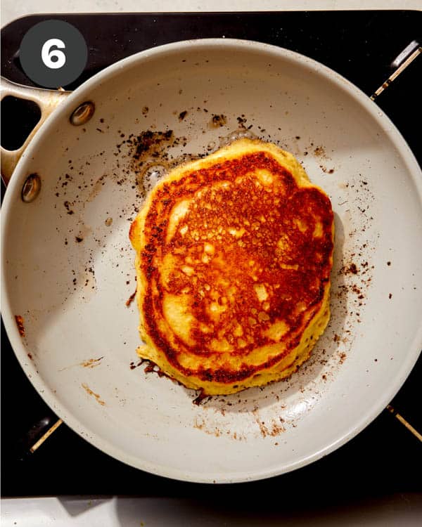 Buttermilk pancakes in a skillet. 