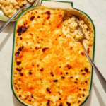 Baked mac and cheese close up in a casserole dish.