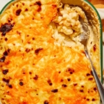 Baked mac and cheese close up in a casserole dish.