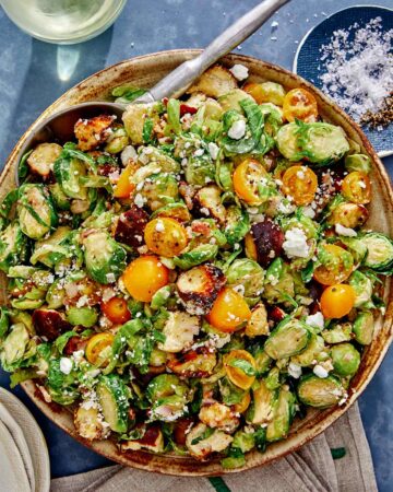 Shaved brussel sprout salad recipe in a bowl.