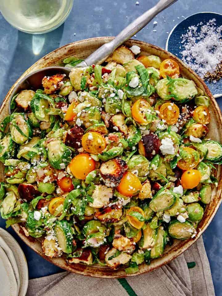 Shaved brussel sprout salad recipe in a bowl.