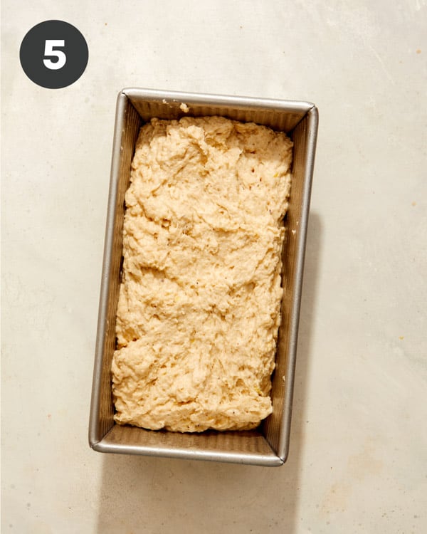 Beer bread dough in a loaf pan pre oven. 