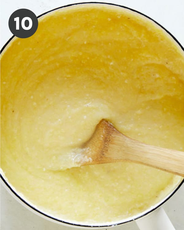 Polenta in a pot being mixed. 