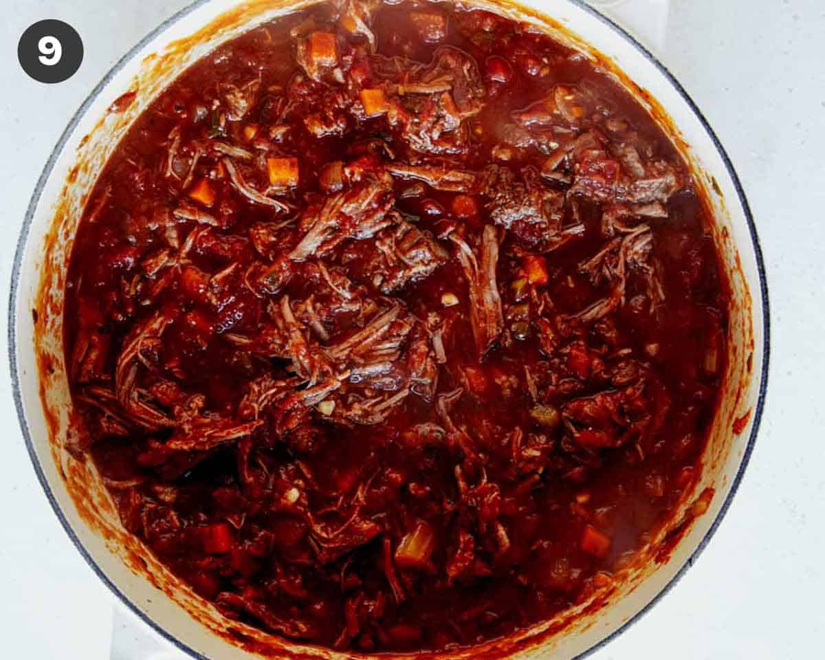 Beef in tomato sauce in a stock pot.