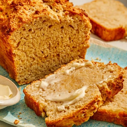 Black pepper parmesan beer bread with butter.