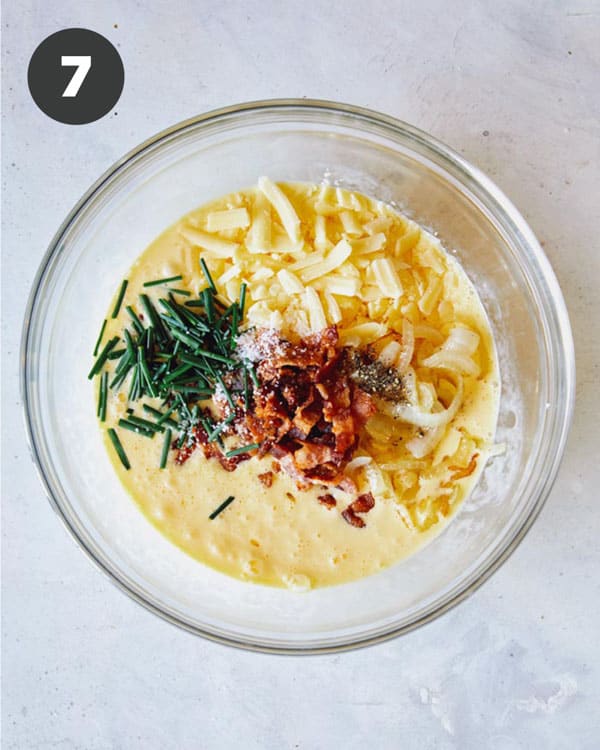 Quiche mixture in a mixing bowl.