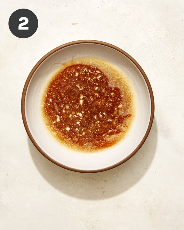 Butter and maple syrup in a bowl for acorn squash. 