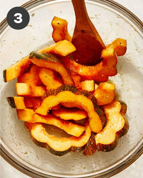 Acorn squash tossed with a maple syrup mixture.