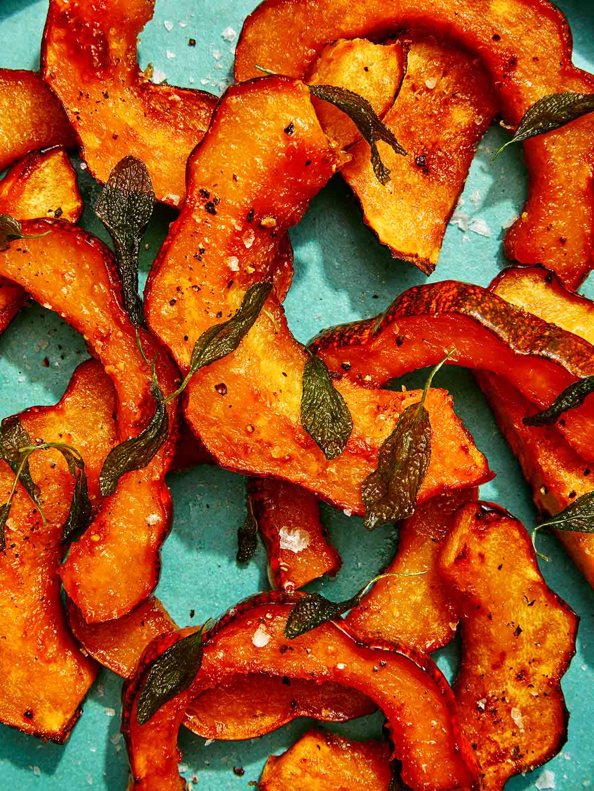 A platter of maple glazed roasted acorn squash up close.